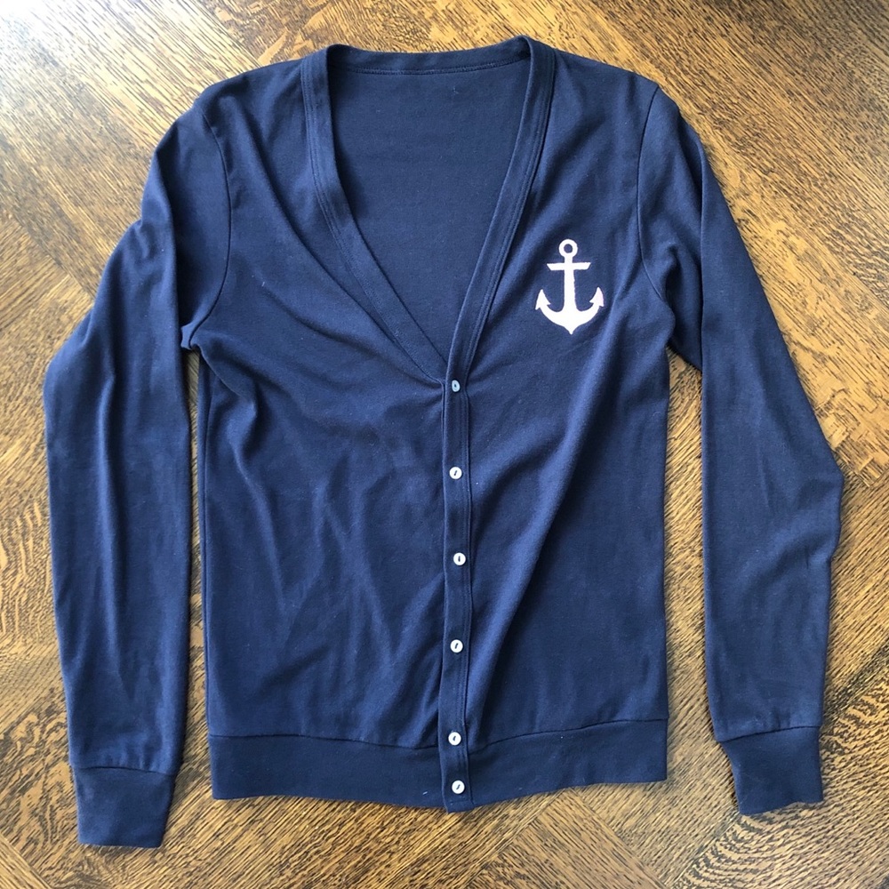 Navy cardigan sweater with pink anchor logo